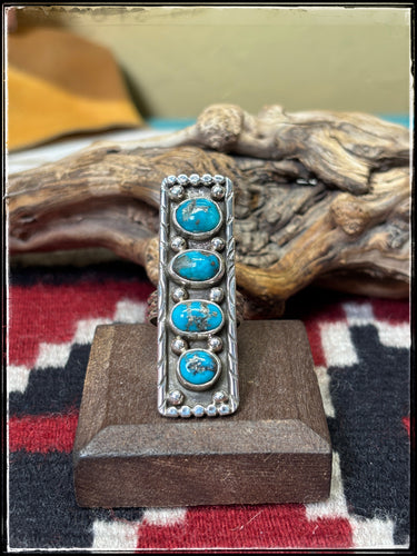 Priscilla Reeder Navajo silversmith. Sterling silver and 4 turquoise stone ar ring. 