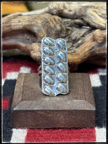 Sterling silver bump out bar ring from Navajo silversmith Priscilla Reeder. 