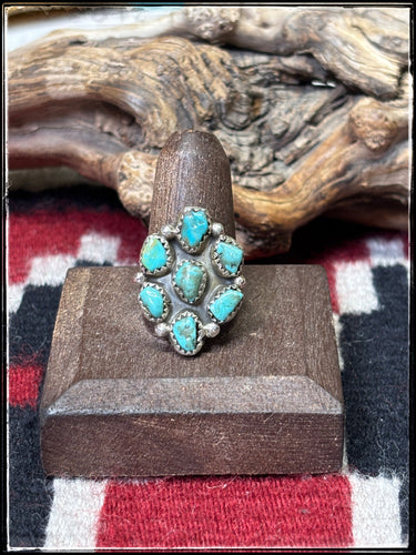 Priscilla Reeder, Navajo silversmith.  Sterling silver and turquoise cluster ring with an adjustable band. 