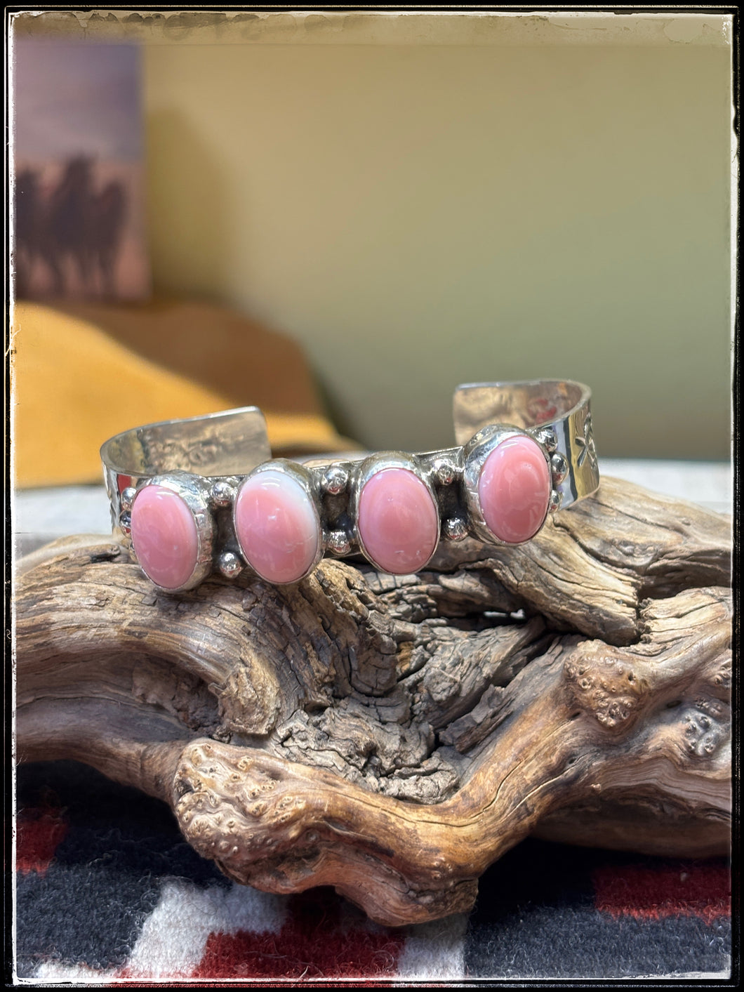 Sterling silver and pink conch row cuff from Navajo silversmith Ernest 