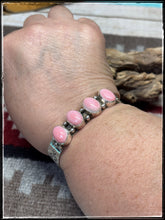 Load image into Gallery viewer, Sterling silver and pink conch row cuff from Navajo silversmith Ernest &quot;Bo&quot; Reeder.  
