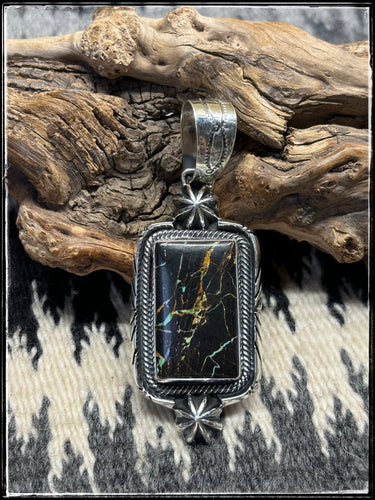 Bobby Johnson, Navajo silversmith.  Sterling silver and Blackjack turquoise pendant.