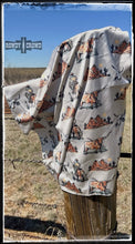 Load image into Gallery viewer, 26&quot; x 26&quot;, 100% polyester wild rag featuring longhorns, cowboys, and southwestern mesas.
