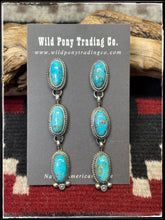 Load image into Gallery viewer, Freda Martinez, Navajo silversmith.  Sterling silver and Kingman turquoise (with pyrite matrix) triple oval drop earrings.  
