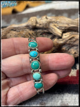Load image into Gallery viewer, Priscilla Reeder, Navajo silversmith.  Sterling silver and 5 Kingman turquoise stone row cuff.
