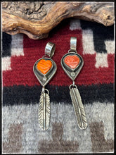 Load image into Gallery viewer, Priscilla Reeder, Navajo silversmith.  Sterling silver and orange spiny shell pendants.
