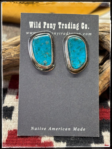 Tommy Jackson, Navajo silversmith.  Sterling silver and Kingman turquoise half moon stud earrings. 