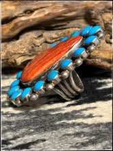Load image into Gallery viewer, Sterling silver, Sleeping Beauty turquoise, and orange spiny oyster shell ring from Navajo silversmith Ernest Roy Begay. 
