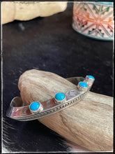 Load image into Gallery viewer, Landon Secatero, Navajo silversmith. Sterling silver and turquoise, carinated cuff.
