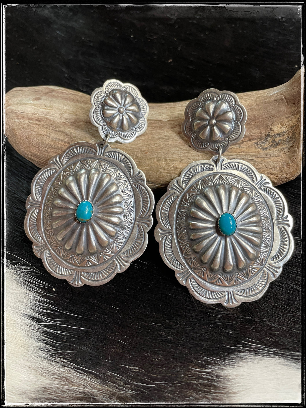 Arnold Blackgoat sterling silver concho earrings and turquoise center stones on french wires.