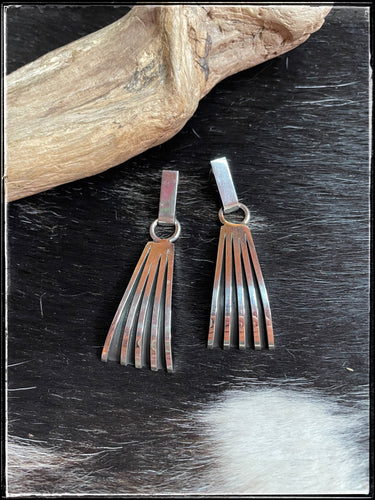 Sterling silver earrings from Navajo silversmith Tom Hawk.