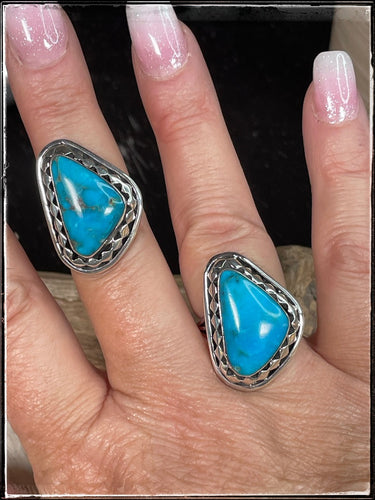 Sterling silver and turquoise rings from Navajo silversmith Mike Smith. Both size 8.