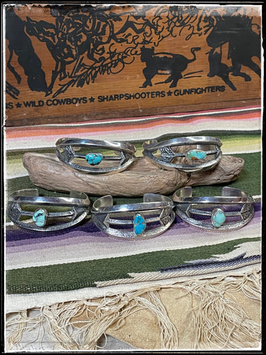 Kevin Yazzie sterling silver and turquoise tufa cast arrow cuffs