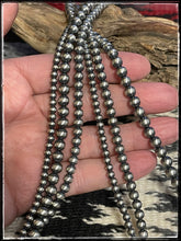 Load image into Gallery viewer, Triple strand of &quot;Navajo Pearl&quot; style sterling silver beads
