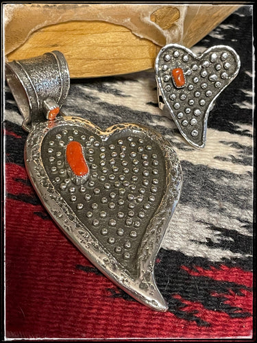 Del Arviso tufa cast heart shaped pendant with coral