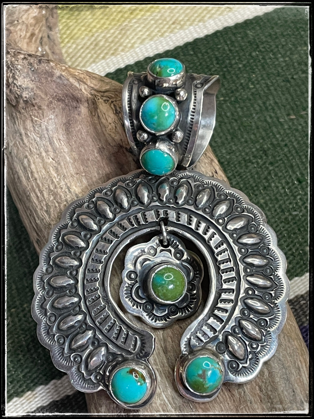 Darryl Becenti turquoise and sterling silver Naja pendants