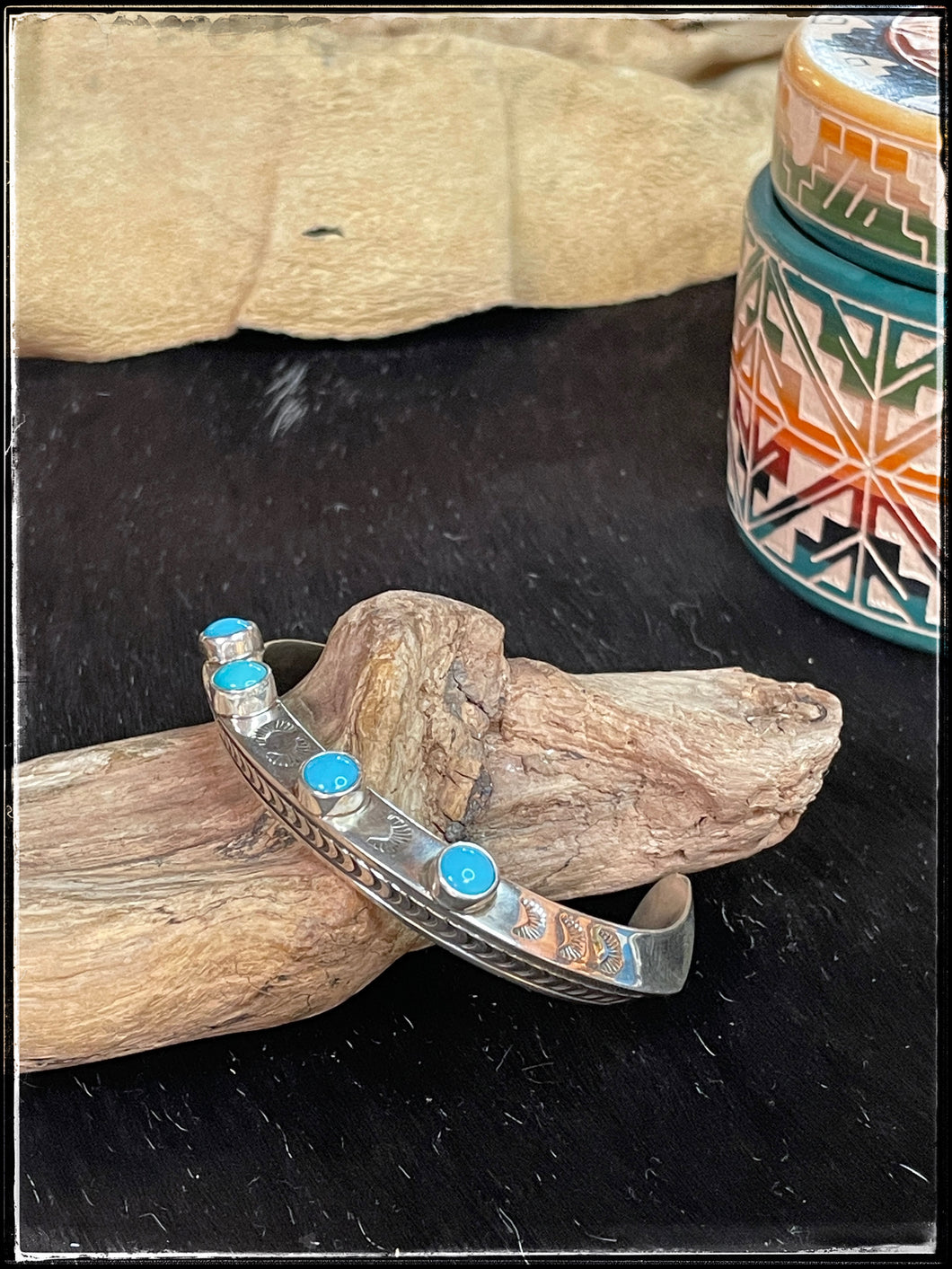 Landon Secatero, Navajo silversmith. Sterling silver and turquoise, carinated cuff.