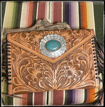 Load image into Gallery viewer, Natural tooled leather envelope clutch with handmade sterling concho and Pilot Mountain turquoise by Ernest Reeder
